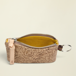 Point of Origin Consuela Lawton pouch in tan tooled leather with a yellow interior and attached metal keyring