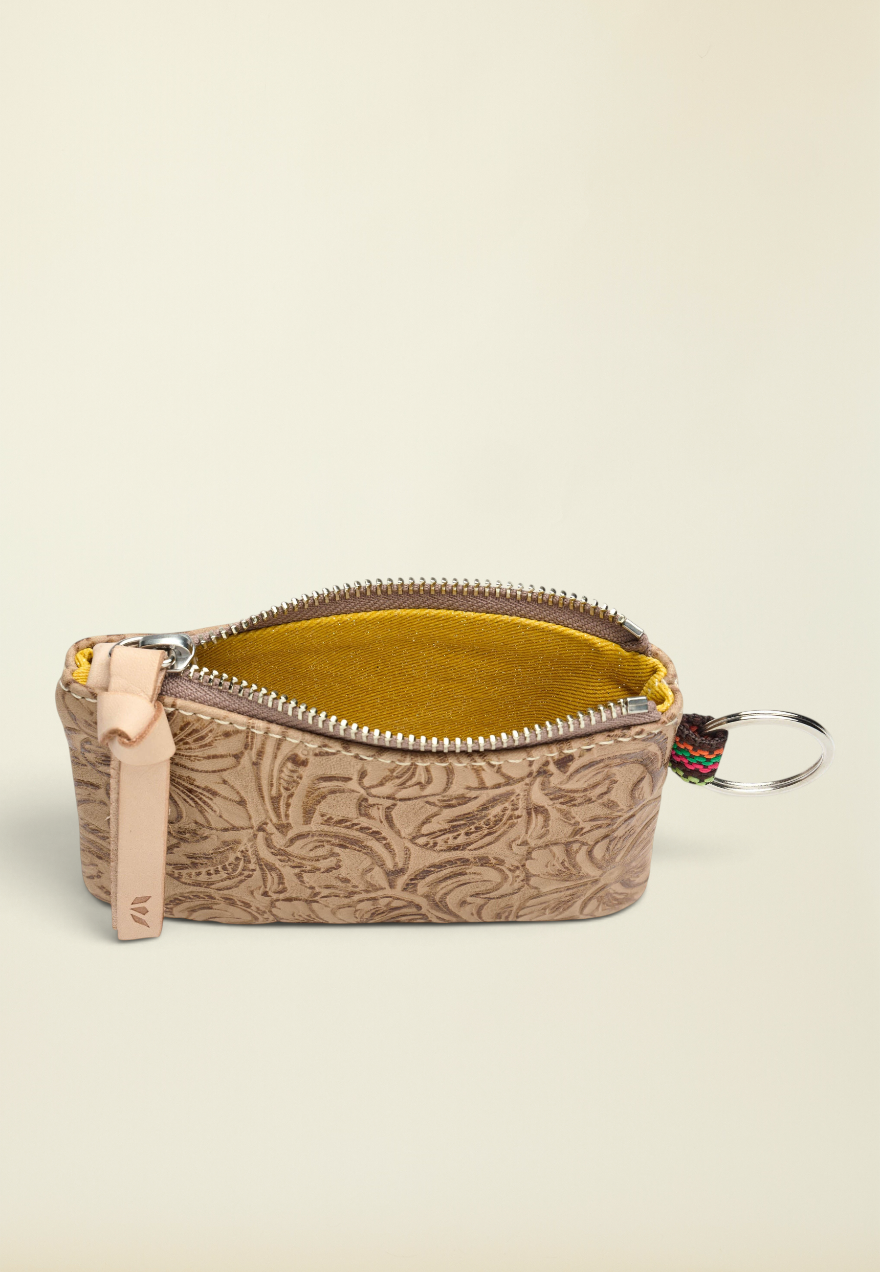 Point of Origin Consuela Lawton pouch in tan tooled leather with a yellow interior and attached metal keyring