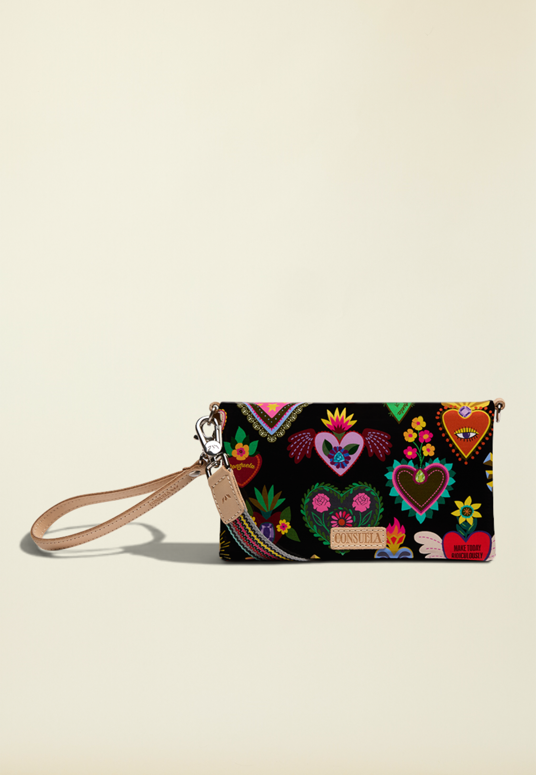 Point of Origin Consuela Vida Uptown crossbody bag in black with colorful heart print and natural leather trim
