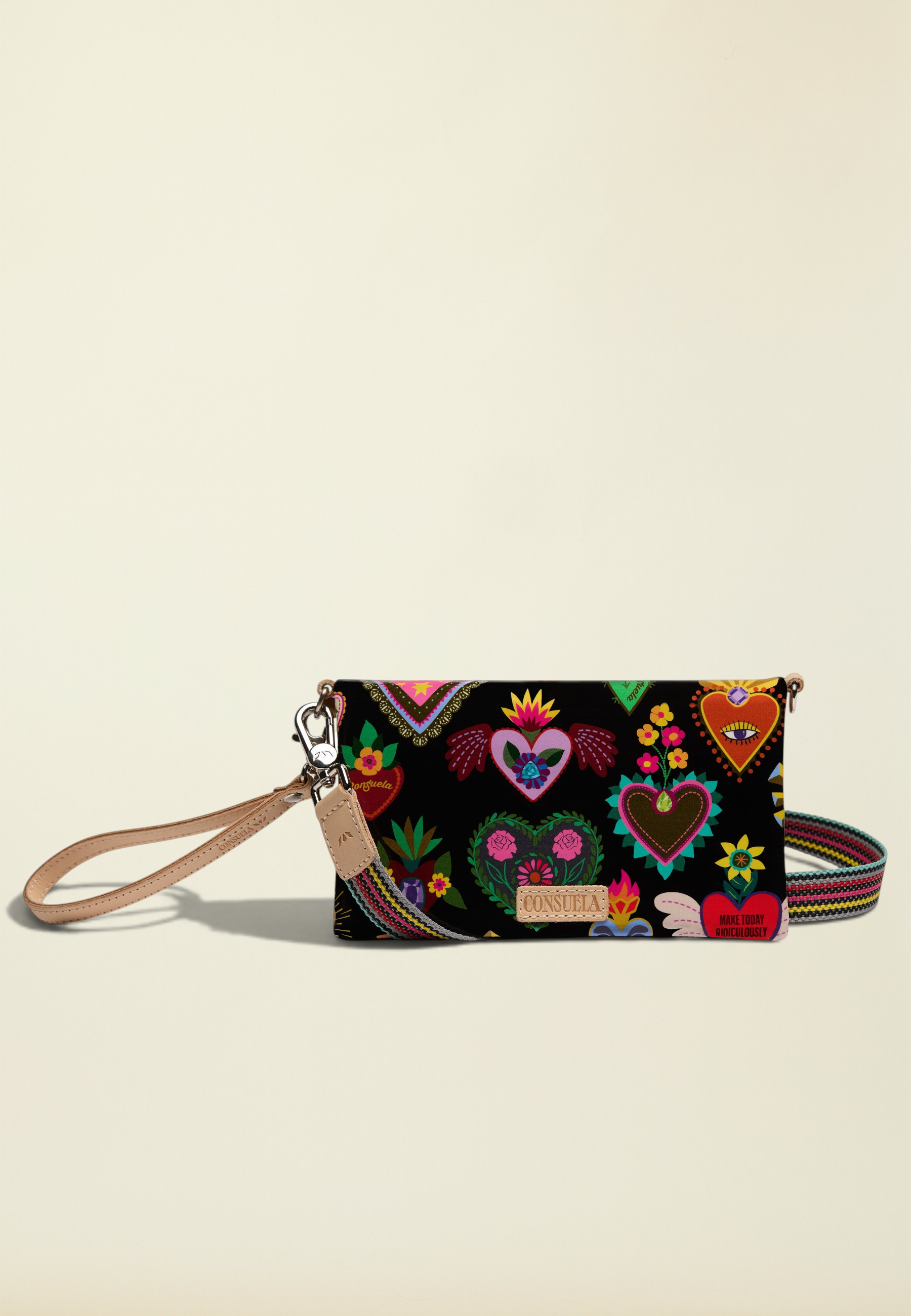 Point of Origin Consuela Vida Uptown crossbody bag in black with colorful heart print and natural leather trim