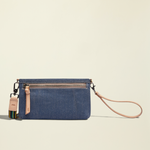 Point of Origin Uptown Crossbody Royal in layered denim with natural leather trim, wristlet strap, and woven strap.