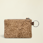 Point of Origin Consuela Lawton pouch in tan tooled leather with a floral pattern, zipper closure, and metal keyring.