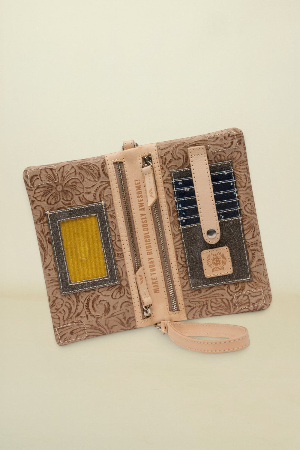 Point of Origin Lawton Uptown Crossbody wallet in tan floral embossed leather with interior card slots and zipper