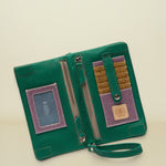 Point of Origin teal leather Uptown Crossbody wallet with interior card slots, ID window, and zipper pocket.