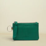 Point of Origin teal leather pouch with a zipper closure, leather pull tab, and a silver keyring attachment.