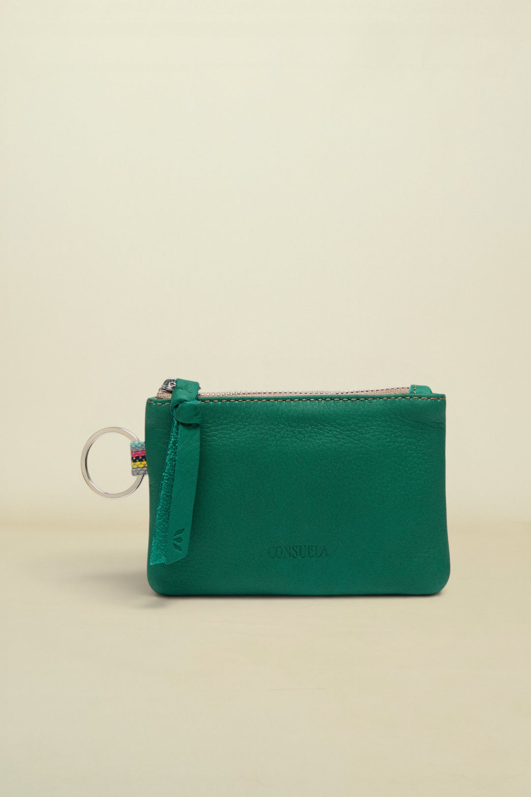 Point of Origin teal leather pouch with a zipper closure, leather pull tab, and a silver keyring attachment.