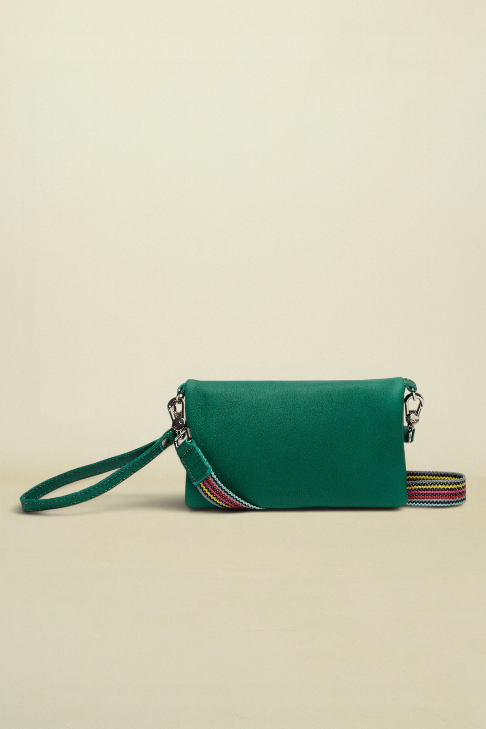 Point of Origin teal Uptown crossbody bag with a detachable multi-colored woven strap and wristlet