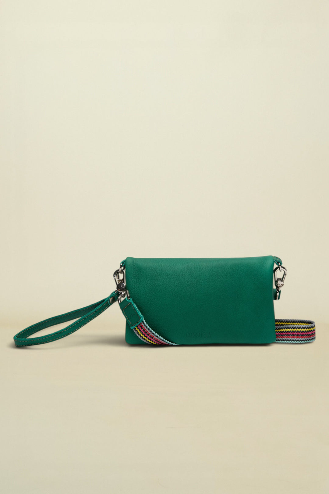 Point of Origin teal Uptown crossbody bag with a detachable multi-colored woven strap and wristlet