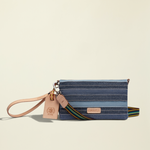 Point of Origin Uptown Crossbody Royal in layered blue denim with natural leather trim and detachable wristlet strap
