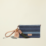 Point of Origin Uptown Crossbody Royal bag in layered blue denim with natural leather trim and wristlet strap.