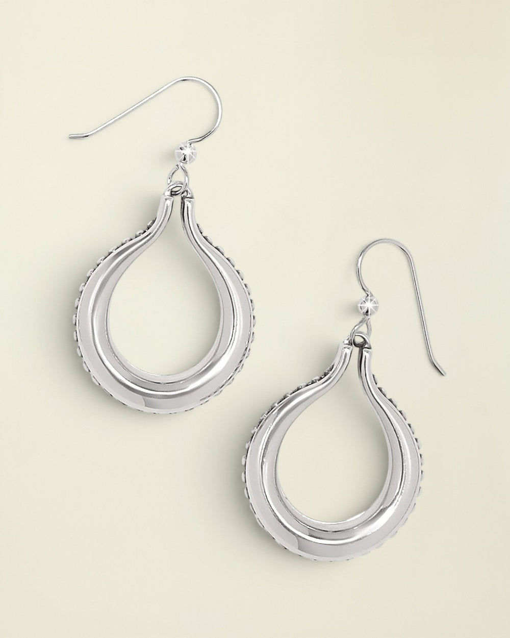 Silver teardrop earrings on a white background