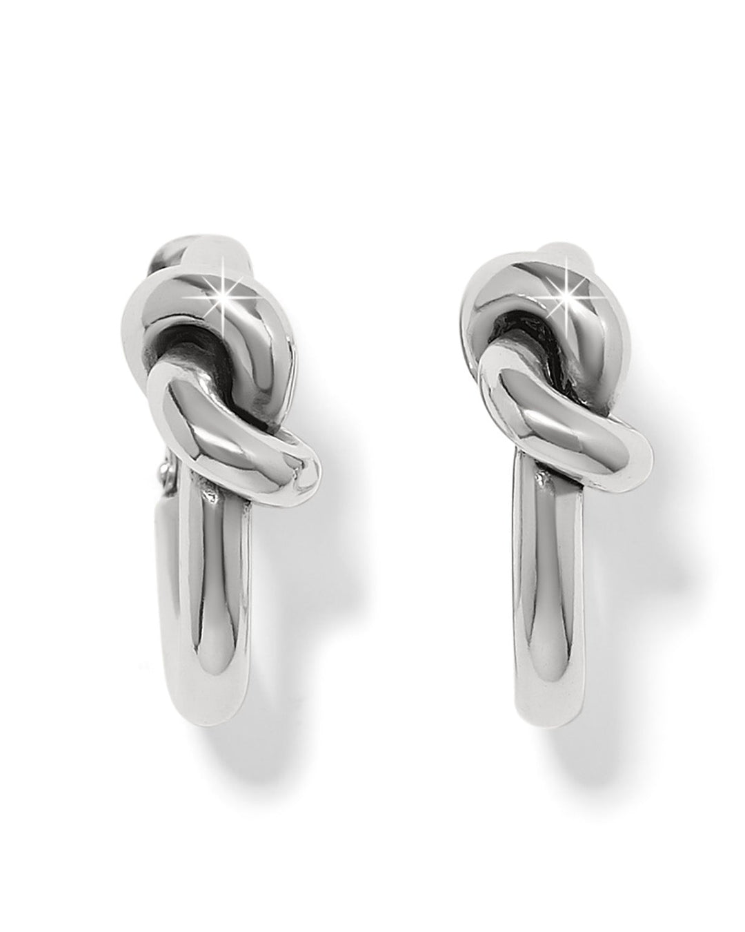 Pair of silver knot earrings on a white background