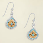 Pair of earrings with decorative designs on a white background