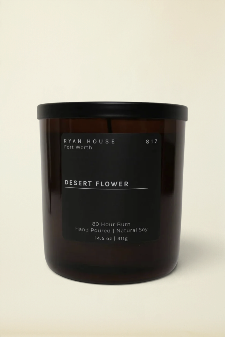 Point of Origin Ryan House Desert Flower soy candle in a dark amber glass jar with a minimalist black label.