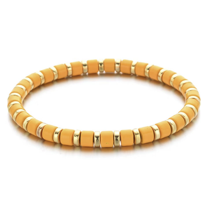 Yellow beaded bracelet with gold accents on a white background