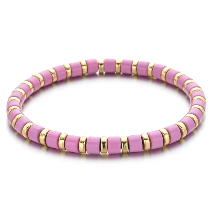 Pink and gold beaded bracelet on a white background