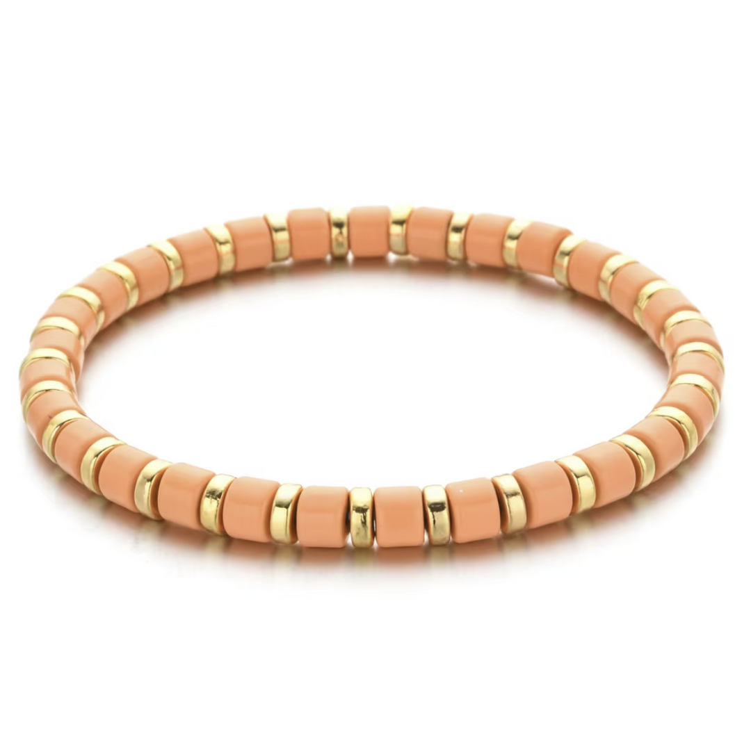 Bracelet with pink and gold beads on a white background