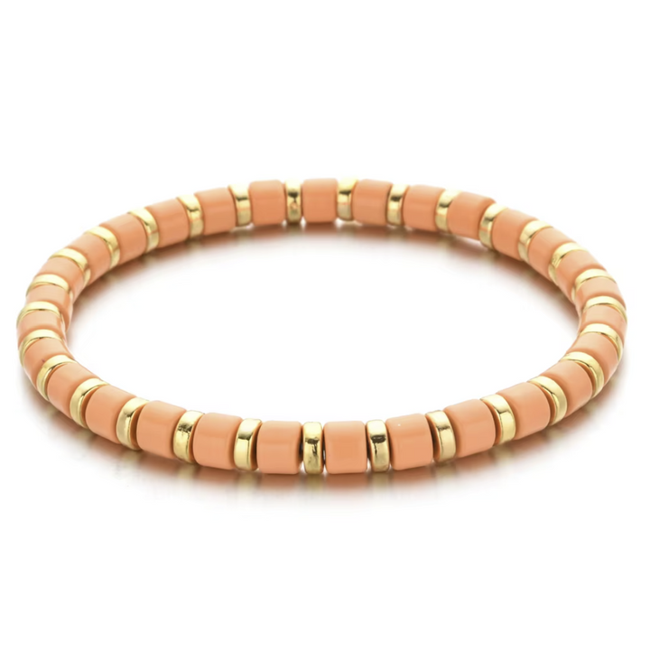 Bracelet with pink and gold beads on a white background