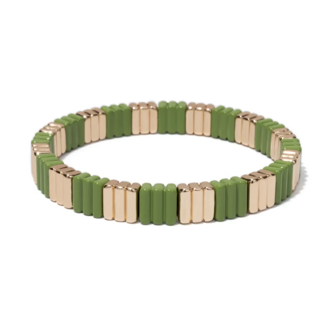Green and gold beaded bracelet on a white background