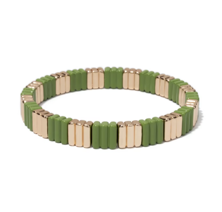 Green and gold beaded bracelet on a white background