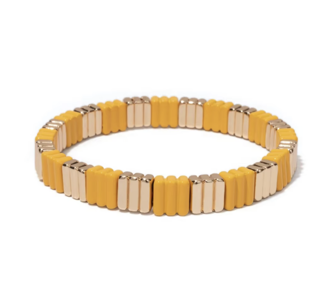 Yellow and gold bracelet on a white background