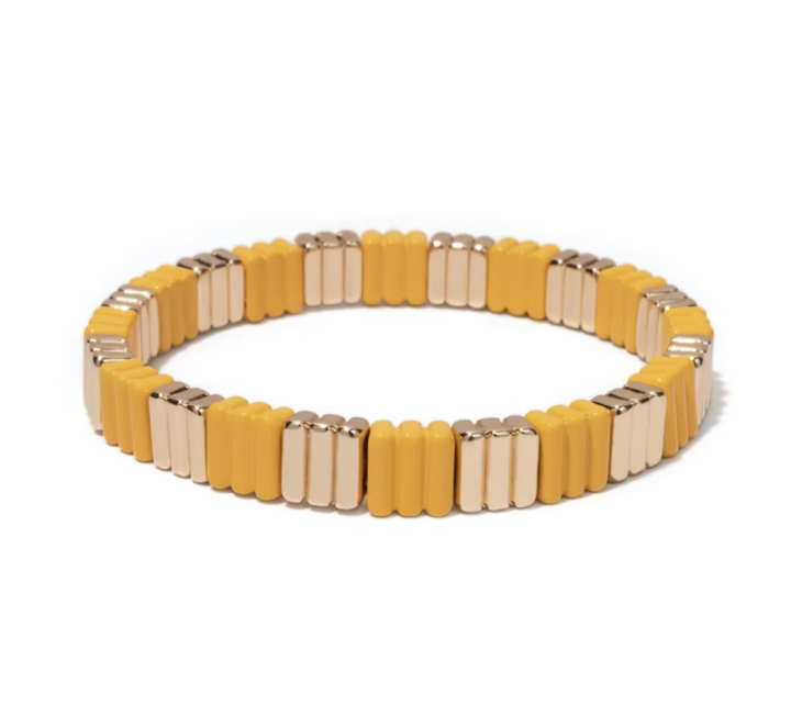 Yellow and gold bracelet on a white background
