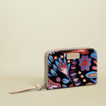 Colorful floral-patterned wallet with a brand name on a white background