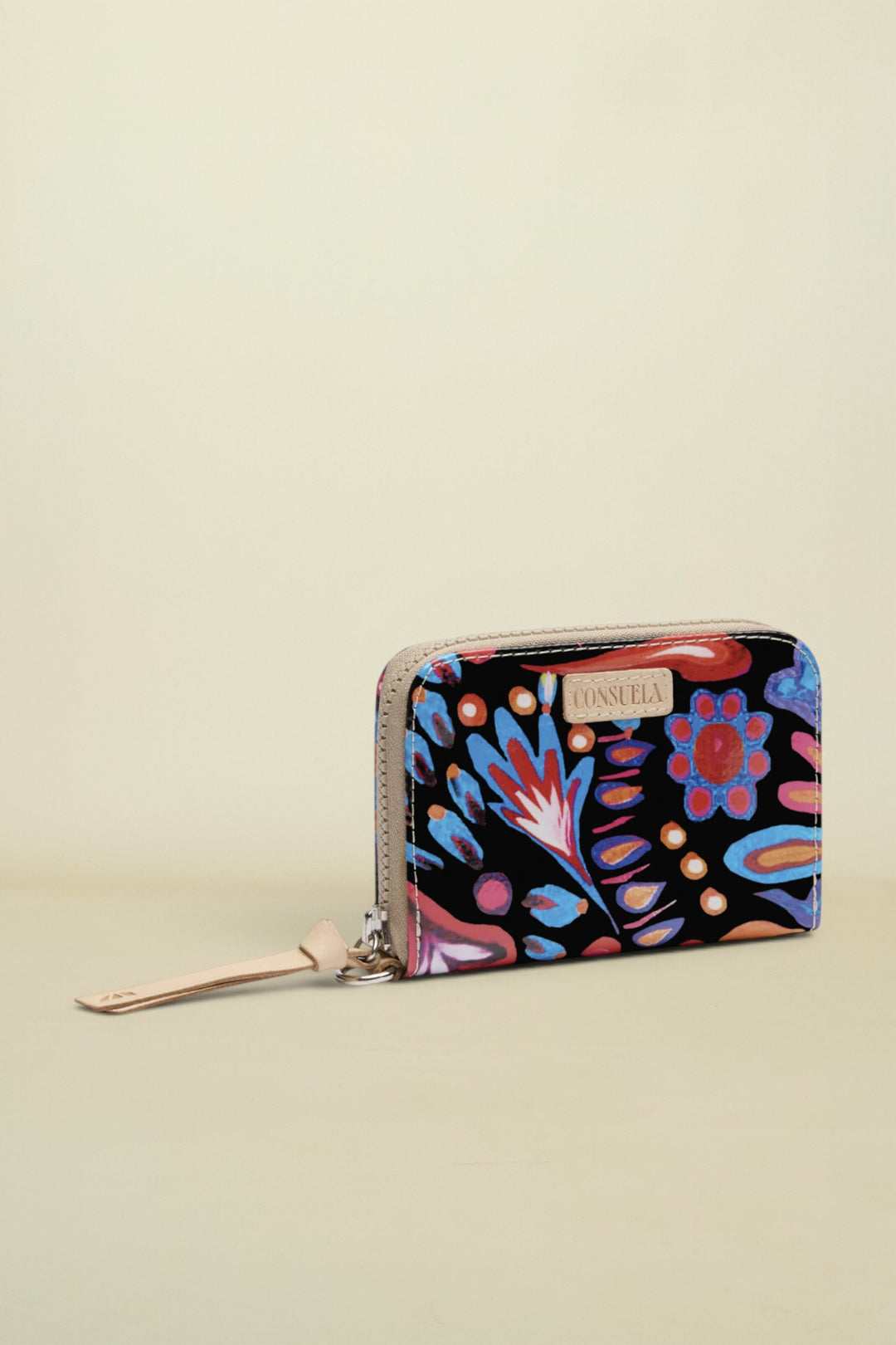Colorful floral-patterned wallet with a brand name on a white background