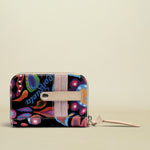 Colorful wallet with floral pattern and brand name on a white background