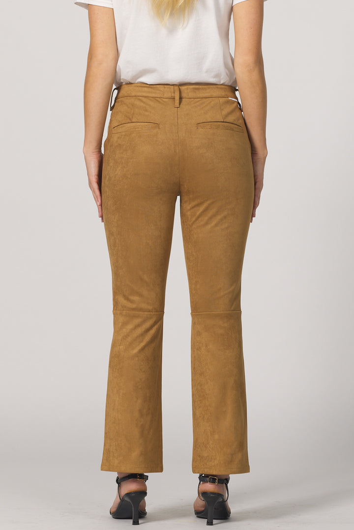 Brown pants worn by a person on a plain background