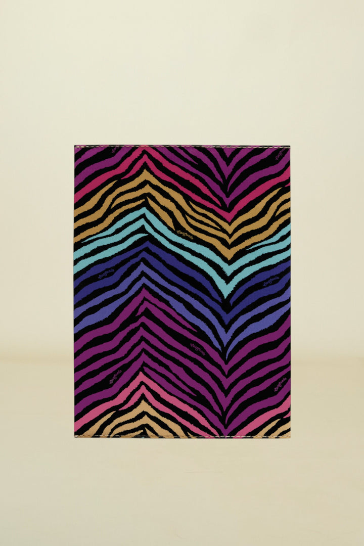 Colorful zebra-striped rug on a white background