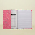 Notebook with pink cover and zebra pattern on a white background