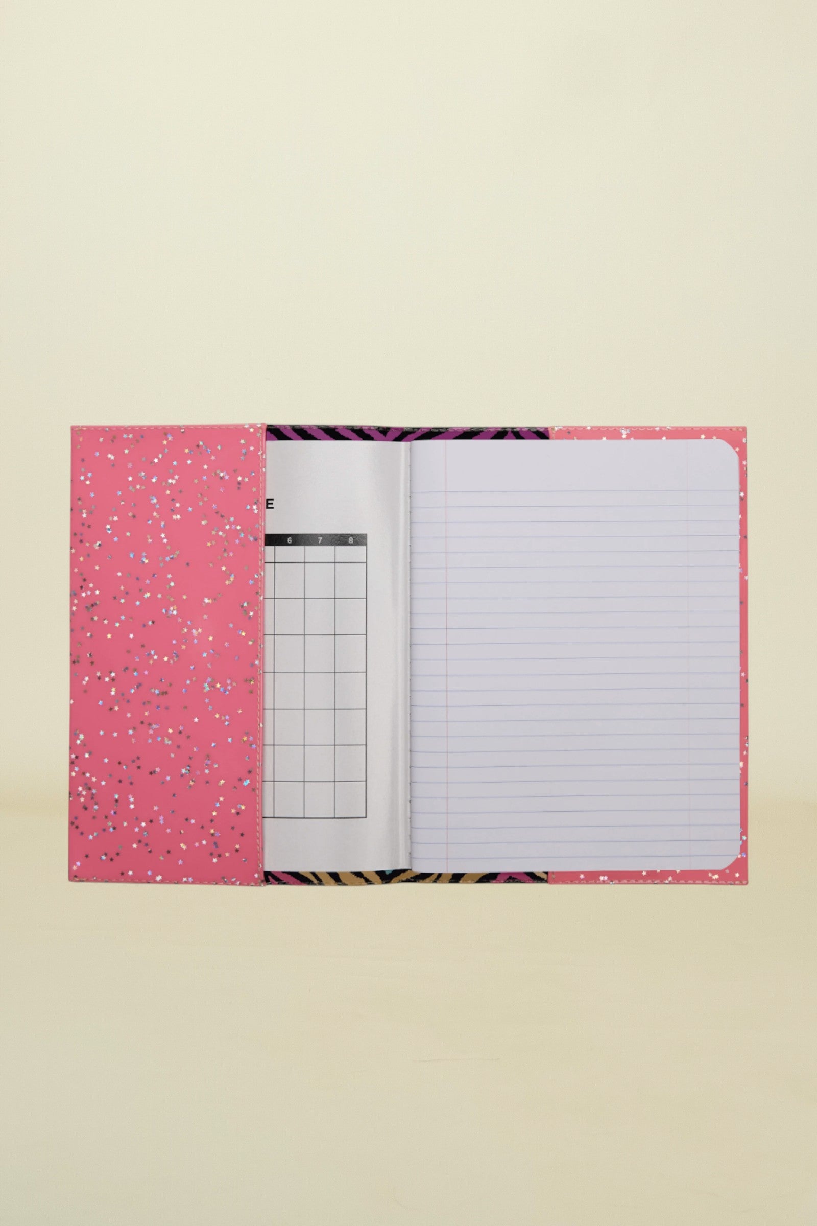 Notebook with pink cover and zebra pattern on a white background