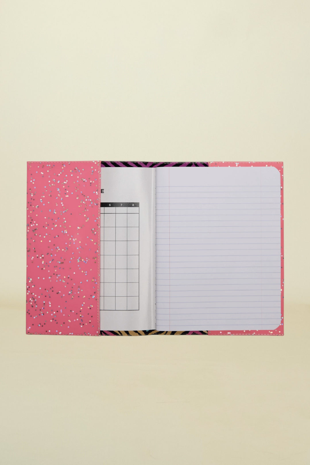 Notebook with pink cover and zebra pattern on a white background