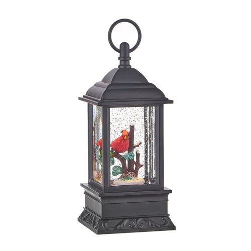 Inside, a beautiful red cardinal for our devoted bird lovers, in swirling glitter. When turned on a warm LED shines down on the figurine and swirling glitter to gives our Cardinal water lantern a whimsical look for the Christmas Holiday season.  Battery Operated or USB Adaptable  9.5 Inch Tall x 4 Inch Wide 3 Position Switch - On / Off / Timer 6 Hour Timer, Repeats Every 18 Hours 3 x AA Batteries Sold Separately Includes USB Cord (USB power adaptor not included)