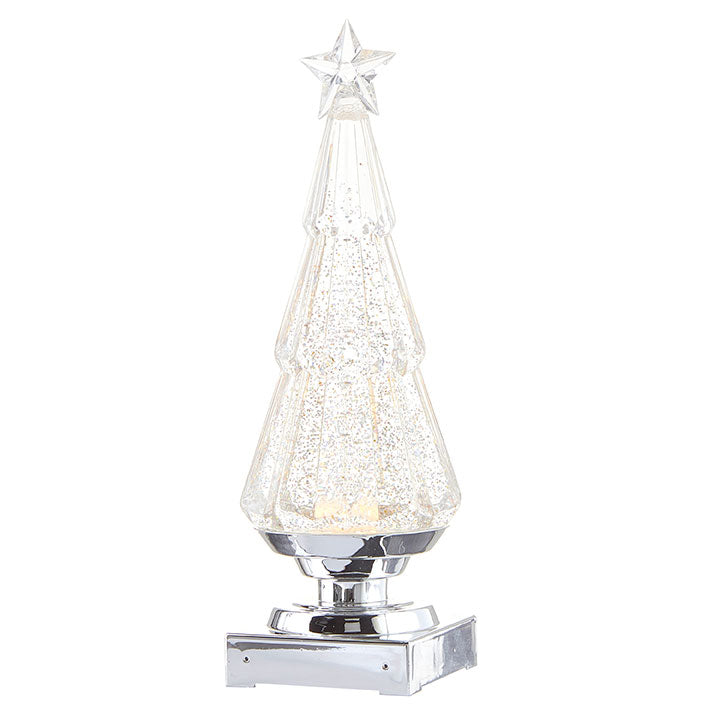 A silver lighted holiday ornament designed in the shape of a Christmas tree with swirling glitter, mounted on a base.