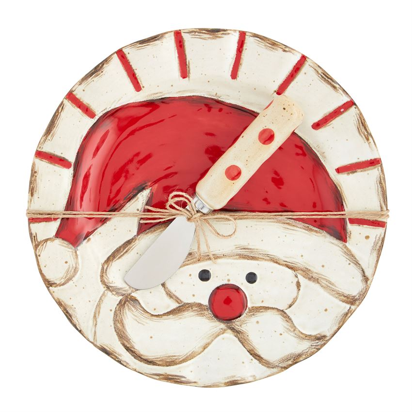 Let the festivities begin! This stunning 2-piece hand-painted set with the coordinating stainless steel spreader offers a decidedly updated take on a classic vintage Christmas icon. We love this set equally when it's paired with the coordinating small serving trays and tartan linens or mixed with solid colors and other festive patterns.   Perfect for gifting. It comes nestled in a craft brown box.  Size: plate is 8 1/2" in diameter, spreader measures 5 1/2" long Material: STONEWARE