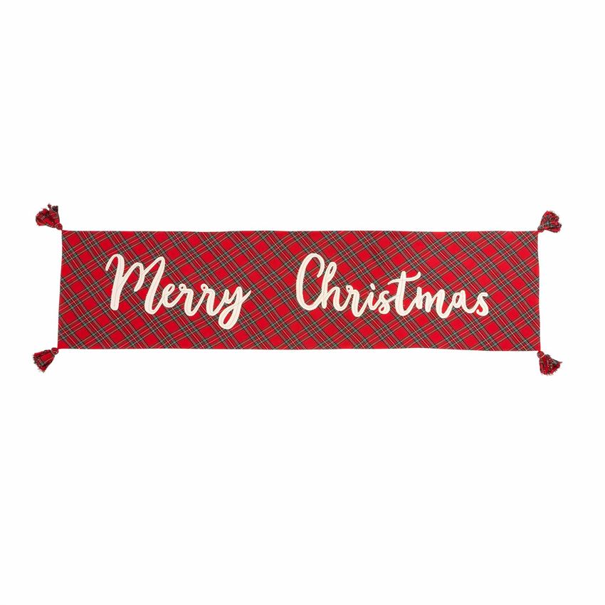 The timeless design of tartan with a "Merry Christmas" accent on one side is designed to work with any style, from traditional to farmhouse to modern. Layer this cotton table runner with all-white dinnerware for a classic look or iconic holiday patterns for a more playful ensemble.   Red tartan "Merry Christmas" runner with tassels reverses to white tartan. Size: 18" x 72" Material: COTTON