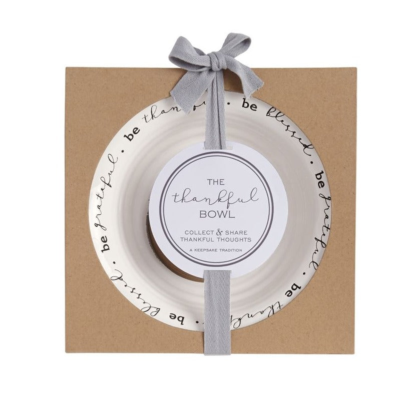 The perfect Thanksgiving tradition! Ceramic bowl features white glazed finish with distressed detail and resist "thankful" sentiments around inner rim. Arrives gift boxed with 25 personalizable kraft cards. Pass and fill this keepsake to share the year's blessings with the whole family.   bowl 3 1/4" x 7 1/2" dia | card 3 1/2" dia