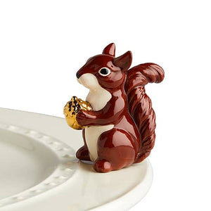 Carrying a tiny golden acorn just for you! a perfect mascot for your fall treats! With Nora Fleming serving platters and minis you can dress up your dinnerware with interchangeable pieces for everyday serving. Add any Nora Fleming Mini to your favorite Nora Fleming platter or base for easy entertaining and for every occasion!
