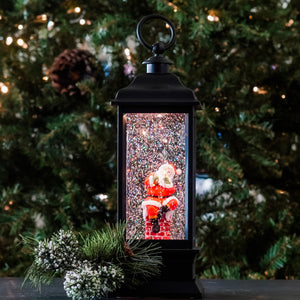 Santa's getting ready to visit all. Inside this LED water lantern. Santa is holding his bag of toys and gifts ready to come down the chimney with swirling glitter, when turned on a warm LED shines down on the figurine to give our water lantern a whimsical look for the Christmas Holiday season. NEW for 2020!