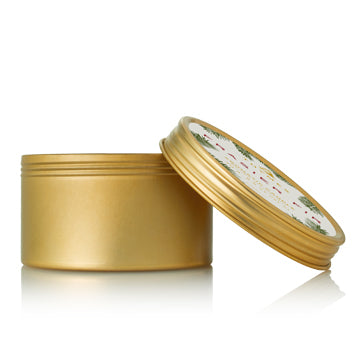 Bring your holiday traditions wherever you go. This perfectly-sized gold travel tin candle allows you to bring the crisp scent of Siberian Fir needles, heartening cedarwood and relaxing sandalwood with you anywhere you go to fill smaller spaces.  Non-metal wick provides a clean burn. Burn time of approximately 16 hours. 2.5 oz.
