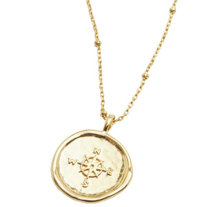 Gorjana Compass Coin Necklace. This unique coin necklace has the feel of a family heirloom. This coin charm centers on an ever-so-dainty ball chain that effortlessly elevates your layered look.