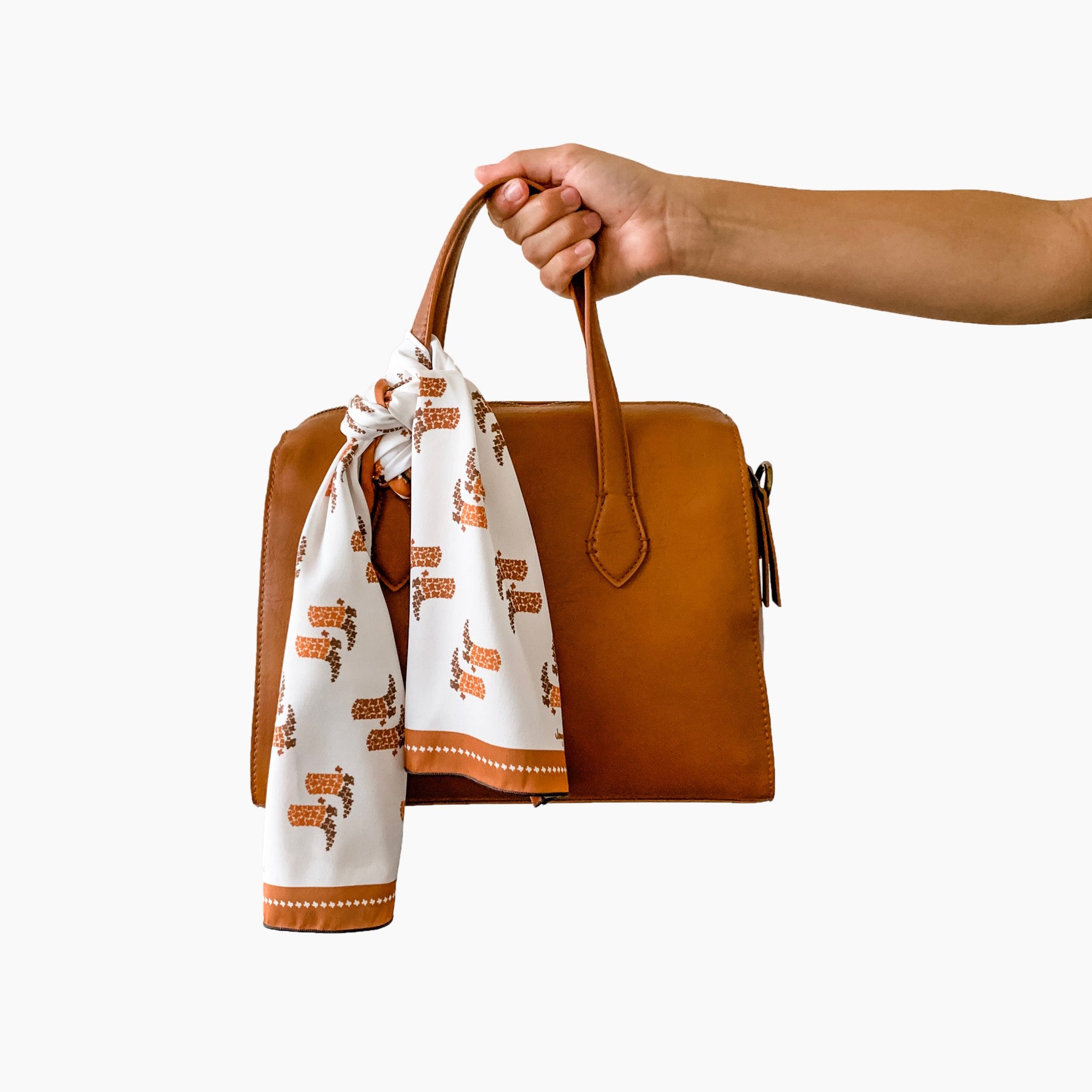 Texas silk scarf, with its hidden state design, will be as much a conversational piece as a wardrobe staple. Use is to adorn you handbag, tie it around your favorite jeans, wear it as a headband, the possibilities are endless! A great gift for yourself or someone else.  Choose from 2 styles: Texas Longhorns or Texas boots 