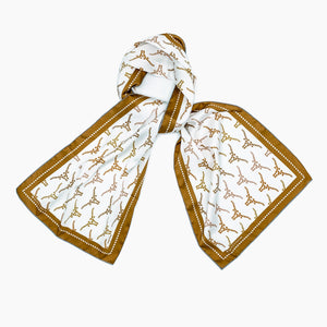 Texas silk scarf, with its hidden state design, will be as much a conversational piece as a wardrobe staple. Use is to adorn you handbag, tie it around your favorite jeans, wear it as a headband, the possibilities are endless! A great gift for yourself or someone else.  Choose from 2 styles: Texas Longhorns or Texas boots 