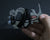 PocketMonkey® multi-tool from Zootility has 21 functions - depending on the model - and fits in your wallet, so it's always there when you need it. From opening bottles to adjusting screws, PocketMonkey multi-tool helps you conquer life's everyday tasks. And it's even TSA-compliant, so you can take it with you whenever you fly.  Made in the USA from heat-treated stainless steel, PocketMonkey multi-tool won't bend, break, or rust.