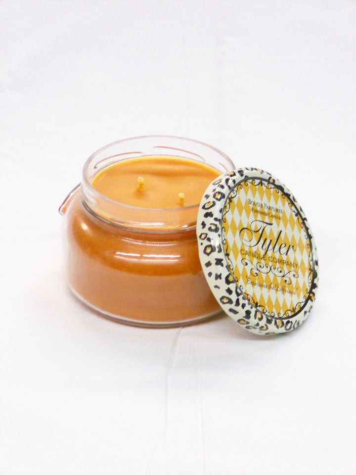Say hello to fall with the Tyler Candle Company. Their unique blend of soy and paraffin wax has produced one of the finest scented candles on the market. Tyler uses the finest quality waxes and opulent fragrance oils available to create the ultimate aroma experience. Each candle is hand-poured, ensuring even burning and maximum fragrance saturation. All jars are guaranteed to fragrance a room in minutes!  Choose from the following scents:   Homecoming Mulled Cider Pumpkin Spice